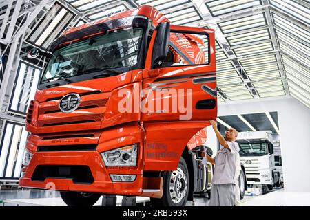 Changchun, China. 07th July, 2023. (230707) -- CHANGCHUN, July 7, 2023 (Xinhua) -- This photo taken on June 27, 2023 shows a worker checking an assembled truck at an intelligent plant of truck manufacturer First Automotive Works Jiefang Co., Ltd. (FAW Jiefang) in Changchun, northeast China's Jilin Province. Founded in 1953 in Changchun, First Automotive Works (FAW) Group Corporation is dubbed the cradle of China's auto industry. As one of China's leading automakers, FAW Group Corporation will celebrate its 70th anniversary of establishment on July 15, 2023. (Xinhua/Xu Chang) Credit: Xinhua/Ala Stock Photo