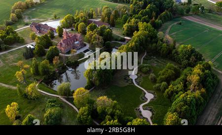 Jaunmoku medieval brick castle complex with pond and park near Tukums, Latvia, aerial view Stock Photo