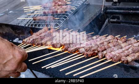 A typical dish of the Abruzzo region of Italy, 'arrosticini' is a product linked to the pastoral tradition, prepared with castrated mutton or lamb. Stock Photo