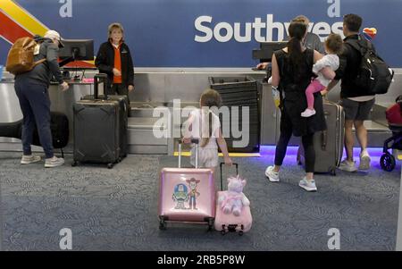 Milwaukee, Wisconsin, USA. 7th July, 2023. Early morning Southwest Airlines passengers check in at General Mitchell International Airport in Milwaukee, Wisconsin Wednesday July 5, 2023. (Credit Image: © Mark Hertzberg/ZUMA Press Wire) EDITORIAL USAGE ONLY! Not for Commercial USAGE! Stock Photo