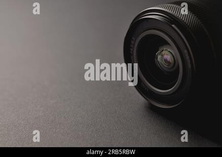 Camera lens on a black background. Close-up. Stock Photo