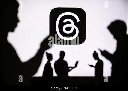 CALIFORNIA, UNITED STATES, JULY 7, 2023: Threads App Wireless Connections: Unveiling the Silhouettes of Youth on Threads App and Social Media Networks Stock Photo