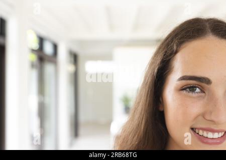 Portrait of happy caucasian woman with long brown hair at home, copy space. Domestic life and lifestyle, unaltered. Stock Photo