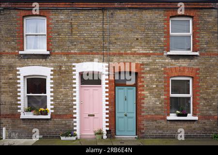 Small old mews houses with colorful brick patterns Stock Photo