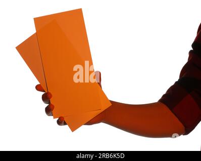 Man holding flyers on white background, closeup and space for text. Color tone effect Stock Photo