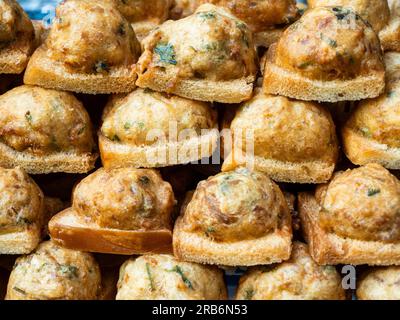 Fried bread with minced pork spread for sale at a local street food market in Bangkok, Thailand. Stock Photo