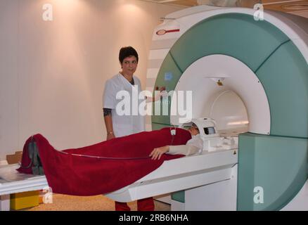 female doctor using a cat scan on an elderly patient Stock Photo