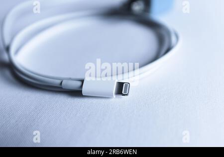 cell phone iphone charging cable. Lightning cable. Battery recharge. High quality photo. Stock Photo