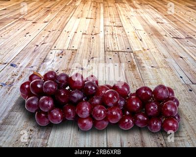 Red green grapes ripe berries product wooden brown wood platform display kenyan east african details plastic containers yummy food delicious details a Stock Photo
