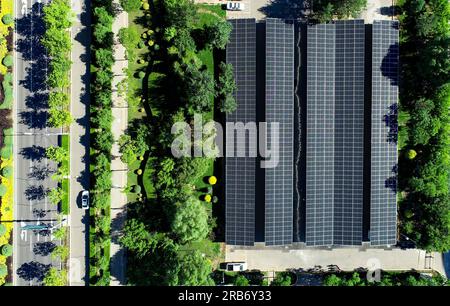 ORDOS, CHINA - JULY 7, 2023 - An aerial photo shows the rooftop photovoltaic power generation project of a public parking lot in Ordos city, Inner Mon Stock Photo