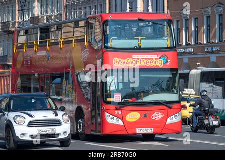 SAINT PETERSBURG, RUSSIA - JUNE 27, 2023: Double-decker sightseeing bus UNVI Urbis 2.5DD close-up in urban traffic flow on a sunny June day Stock Photo