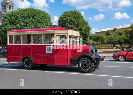 SAINT PETERSBURG, RUSSIA - JUNE 27, 2023: Sightseeing retro bus (replica of the ZIS-8 bus) on the city street on a sunny June day Stock Photo