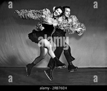 San Francisco, California:  August 26, 1940. Ice Follies stars Bruce Mapes and Evelyn Chandler show their style in this dynamic photo. Stock Photo