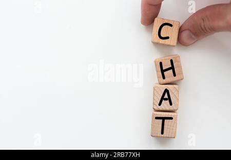 Word CHAT made with wood blocks on a light background Stock Photo
