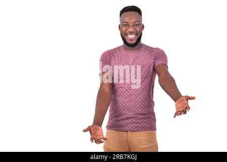 portrait of a handsome happy young man stretching out his arms while smiling at the camera. Stock Photo