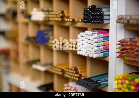 Selective focus on a large assortment of graphite pencils in different softness, for drawing, shading on shelves in the school stationery store or off Stock Photo