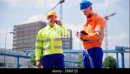 Inspection Engineer Worker At Construction Site Using Tablet Stock Photo