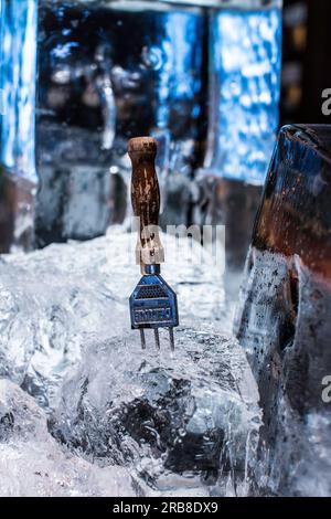 ice with an ice picker with wooden handle at the Zuma bar restaurant in Dubai united Arab Emirates Stock Photo