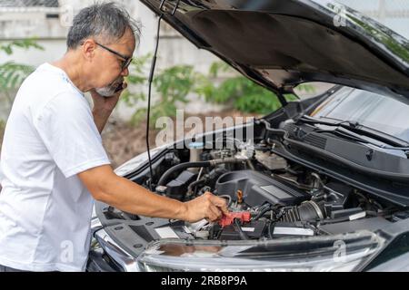 A man is working on a car's engine. Diagnosis auto repair workshop. -  PICRYL - Public Domain Media Search Engine Public Domain Search