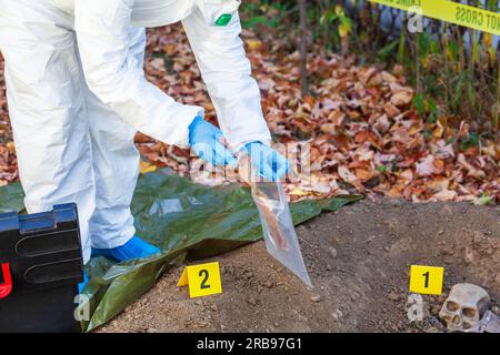 Forensic science specialist at work, collecting evidence at the ...