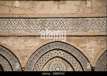 Architectural detail with Norman and Arabesque elements on the exterior of the Gothic Catalan style Cathedral of Palermo in Sicily, Italy. Stock Photo