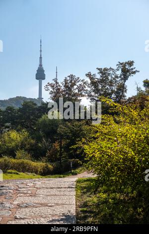 Walkway next to Hanyangdoseong Wall or Seoul City Wall in Namsan park, with the view of N Seoul Tower. South Korea Stock Photo