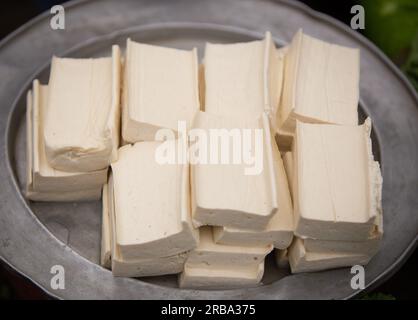 Plate of Raw Tofu at the street market for sale Stock Photo