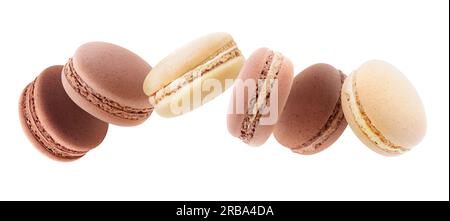 Macaroons of different shades of brown levitation isolated on white panorama Stock Photo