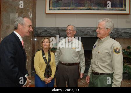 Secretary Dirk Kempthorne at the Great Smoky Mountains Sustainable Tourism Summit, Knoxville Convention Center, Knoxville, Tenneessee: speaking with National Park Service personnel, and helping to honor Great Smoky Mountains conservation contributors with Take Pride in America Awards Stock Photo