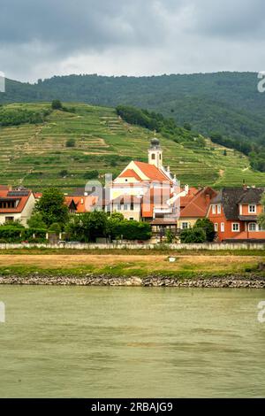 Woesendorf, Lower Austria - AT - June 8, 2023 View of the village of Woesendorf and its baroque parish church along the Danube River in the Wachau Val Stock Photo