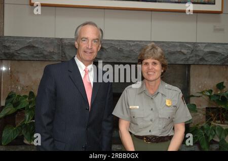 Secretary Dirk Kempthorne at the Great Smoky Mountains Sustainable Tourism Summit, Knoxville Convention Center, Knoxville, Tenneessee: speaking with National Park Service personnel, and helping to honor Great Smoky Mountains conservation contributors with Take Pride in America Awards Stock Photo