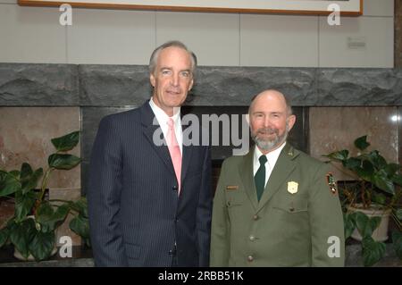 Secretary Dirk Kempthorne at the Great Smoky Mountains Sustainable Tourism Summit, Knoxville Convention Center, Knoxville, Tenneessee: speaking with National Park Service personnel, and helping to honor Great Smoky Mountains conservation contributors with Take Pride in America Awards Stock Photo