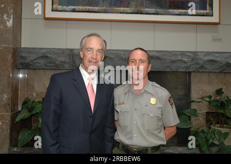 Secretary Dirk Kempthorne at the Great Smoky Mountains Sustainable Tourism Summit, Knoxville Convention Center, Knoxville, Tenneessee: speaking with National Park Service personnel, and helping to honor Great Smoky Mountains conservation contributors with Take Pride in America Awards Stock Photo