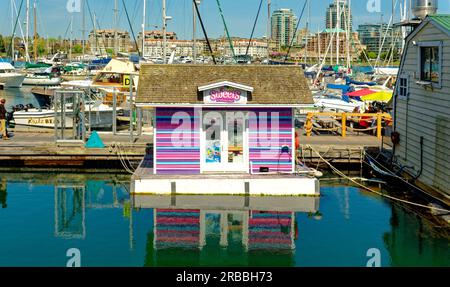 VICTORIA, BRITISH COLUMBIA - May 2, 2023: Fisherman's Wharf is a unique destination with working fishing vessels, pleasure boats, float homes and kios Stock Photo