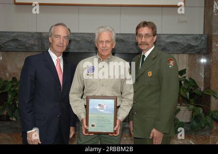 Secretary Dirk Kempthorne at the Great Smoky Mountains Sustainable Tourism Summit, Knoxville Convention Center, Knoxville, Tenneessee: speaking with National Park Service personnel, and helping to honor Great Smoky Mountains conservation contributors with Take Pride in America Awards Stock Photo