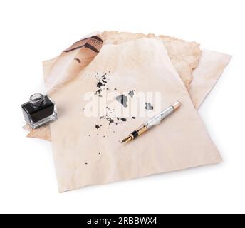 Parchment with stains of ink, feather pen and inkwell on white background Stock Photo