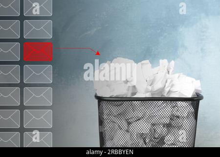 Red envelope among others with arrow leading to bin symbolizing spam removing Stock Photo