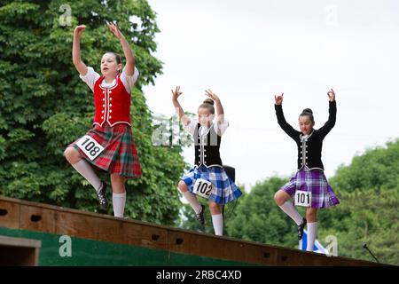 Mount Vernon, Washington, USA. 8th July, 2023. Three young women compete in Sword Dance at the Skagit Valley Highland Games. Credit: Paul Christian Gordon/Alamy Live News Stock Photo