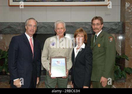 Secretary Dirk Kempthorne at the Great Smoky Mountains Sustainable Tourism Summit, Knoxville Convention Center, Knoxville, Tenneessee: speaking with National Park Service personnel, and helping to honor Great Smoky Mountains conservation contributors with Take Pride in America Awards Stock Photo