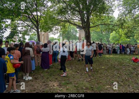 New York, United States. 08th July, 2023. NEW YORK, NEW YORK - JULY 08: People stand in queue for food at an Eid Al Adha event at Astria Park on July 8, 2023 in the Queens borough of New York City. Credit: Ron Adar/Alamy Live News Stock Photo