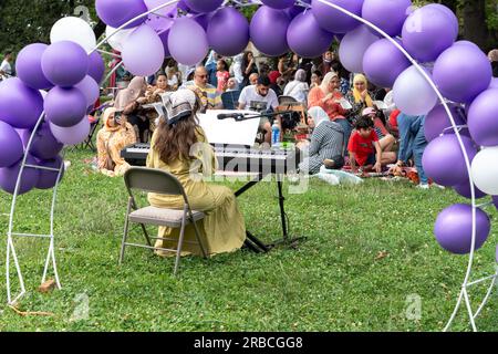 New York, United States. 08th July, 2023. NEW YORK, NEW YORK - JULY 08: A musician performs at an Eid Al Adha event at Astoria Park on July 8, 2023 in the Queens borough of New York City. Credit: Ron Adar/Alamy Live News Stock Photo