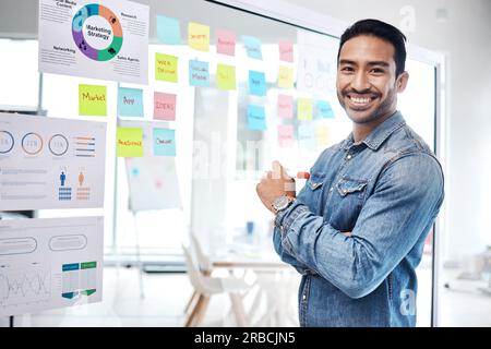 Data, graphs and man business consultant with financial information or profit strategy of startup growth or goal. Portrait, presentation and young Stock Photo
