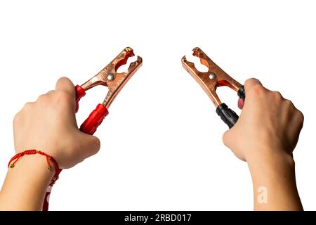 battery jumper cables in hands, isolated on white background Stock Photo