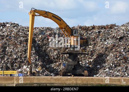 Large yellow crane at the scrap yard Stock Photo