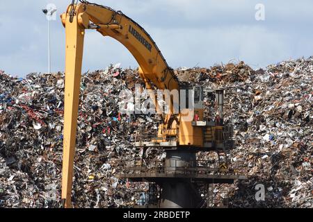 Large yellow crane at scrap yard Stock Photo