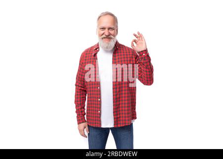 handsome well-groomed 60s retired man with white beard and mustache Stock Photo