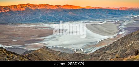 Badwater Basin, low fog at sunrise, Panamint Range, Telescope Peak in distance on left, from Dantes View area, Death Valley National Park, California Stock Photo
