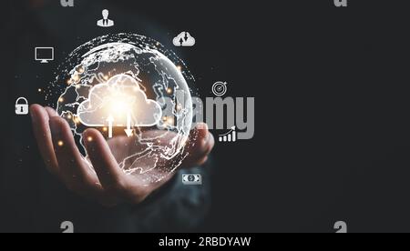 A businessman's hand holds a globe, illustrating seamless connectivity and data flow across global network Stock Photo