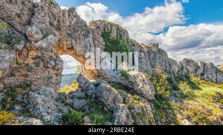 La forada or foradada arch is a spectacular stone arch, of great beauty, from which to observe the entire Gallinera valley, declared a Natural Site by Stock Photo
