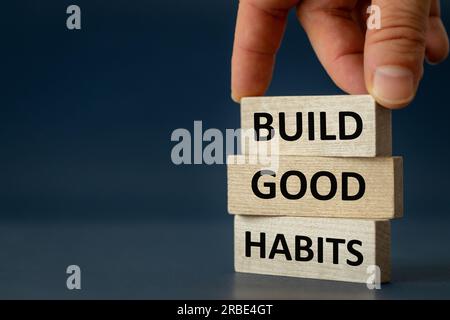 Build Good Habits Symbol, Concept, Wooden Blocks with 'Build Good Habits' Motto Navy Blue Background, Copy Space, Psychology, Business, Successful Bui Stock Photo